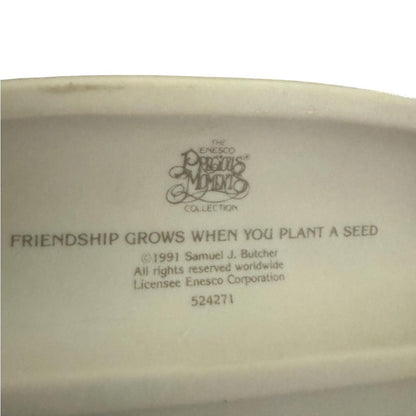 “ Friendship grows when you plant a seed” Figurine
 precious moments