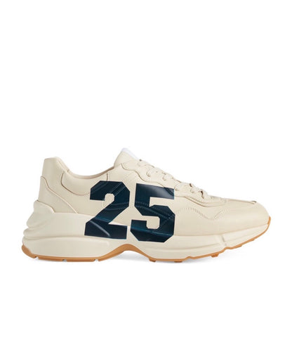 The Gucci Eschatology Rhyton leather sneaker with "Gucci Eschatology 1921" and "25" script.