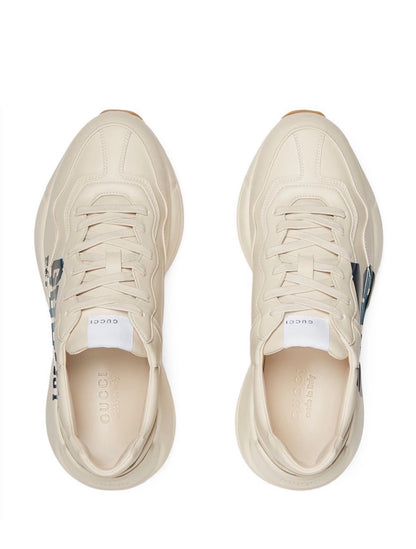 The Gucci Eschatology Rhyton leather sneaker with "Gucci Eschatology 1921" and "25" script.